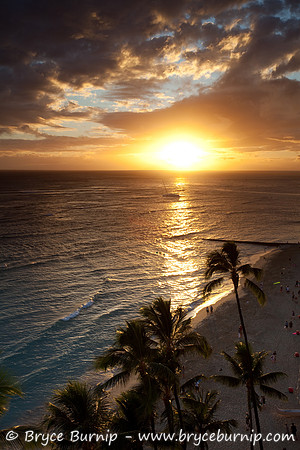 Waikiki, Hawaii, USA - Sun setting on Waikiki Beach.